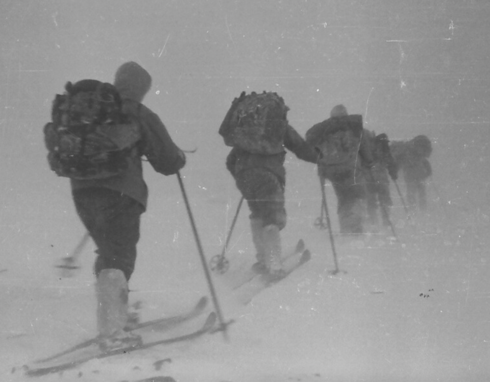 Black and white photo of explorers on cross country skis